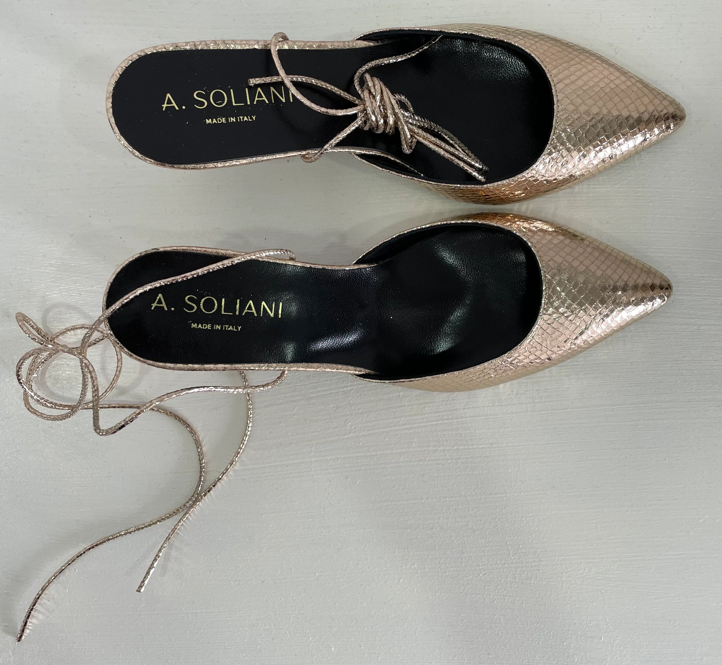 Gold snake deals heels